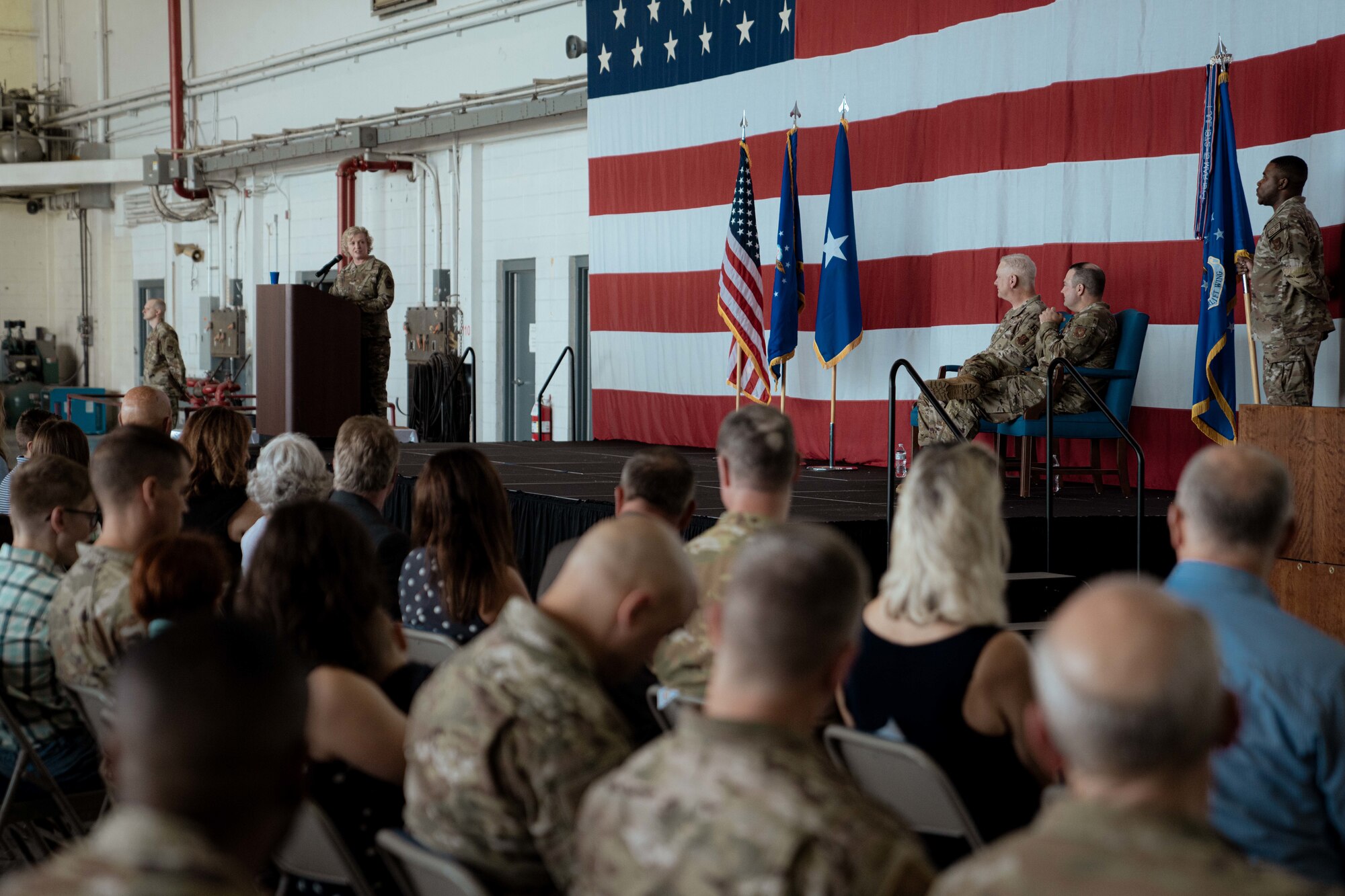 Brig. Gen. Melissa A. Coburn, 22nd Air Force commander, speaks on-stage at the 94th Airlift Wing change of command ceremony.