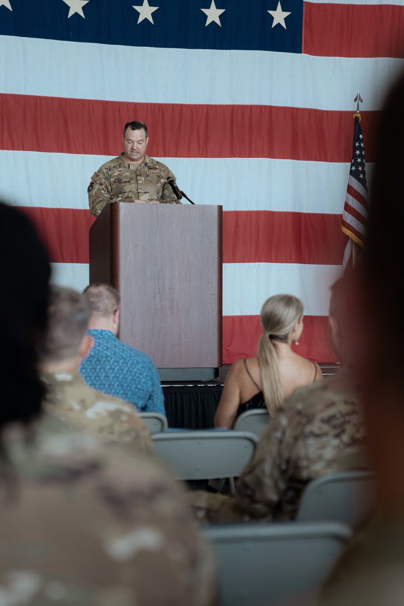 Col. Michael Parks, 94th Airlift Wing commander, speaks on-stage during his change of command ceremony.