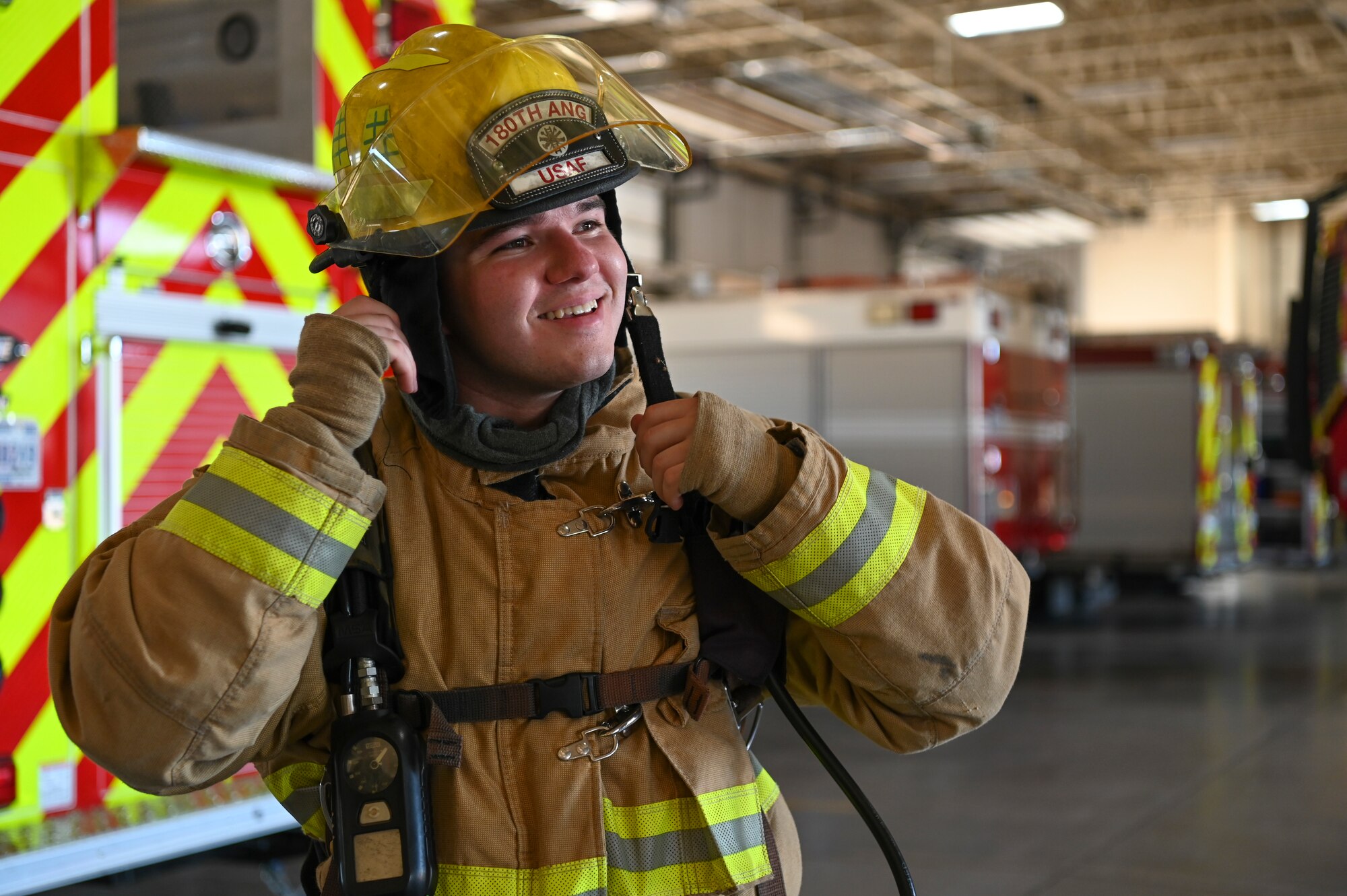 Carson Duncan, Baylor University Air Force ROTC cadet, puts on firefighting equipment during Project Tuskegee 2.0 at Dyess Air Force Base, Texas, Aug. 1, 2023. The project is intended to increase the cadets' understanding of Air Force and Space Force missions and day-to-day operations. The 19 cadets in attendance represent 19 different Air Force ROTC detachments across the enterprise's four regions. (U.S. Air Force photo by Airman 1st Class Emma Anderson)