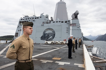 U.S. Marines with the 26th Marine Expeditionary Unit (Special Operations Capable) (MEU(SOC)) and Sailors assigned to the San Antonio-class amphibious transport dock ship USS Mesa Verde (LPD 19) conduct a Manning the Rails ceremony during their a port visit on their scheduled deployment in Narvik, Norway, August 5, 2023. The USS Mesa Verde, assigned to the Bataan Amphibious Ready Group and embarked 26th MEU(SOC), under the command and control of Task Force 61/2, is on a scheduled deployment in the U.S. Naval Forces Europe area of operations, employed by U.S. Sixth Fleet to defend U.S., allied and partner interests. (U.S. Marine Corps photo by Staff Sgt. Jesus Sepulveda Torres)