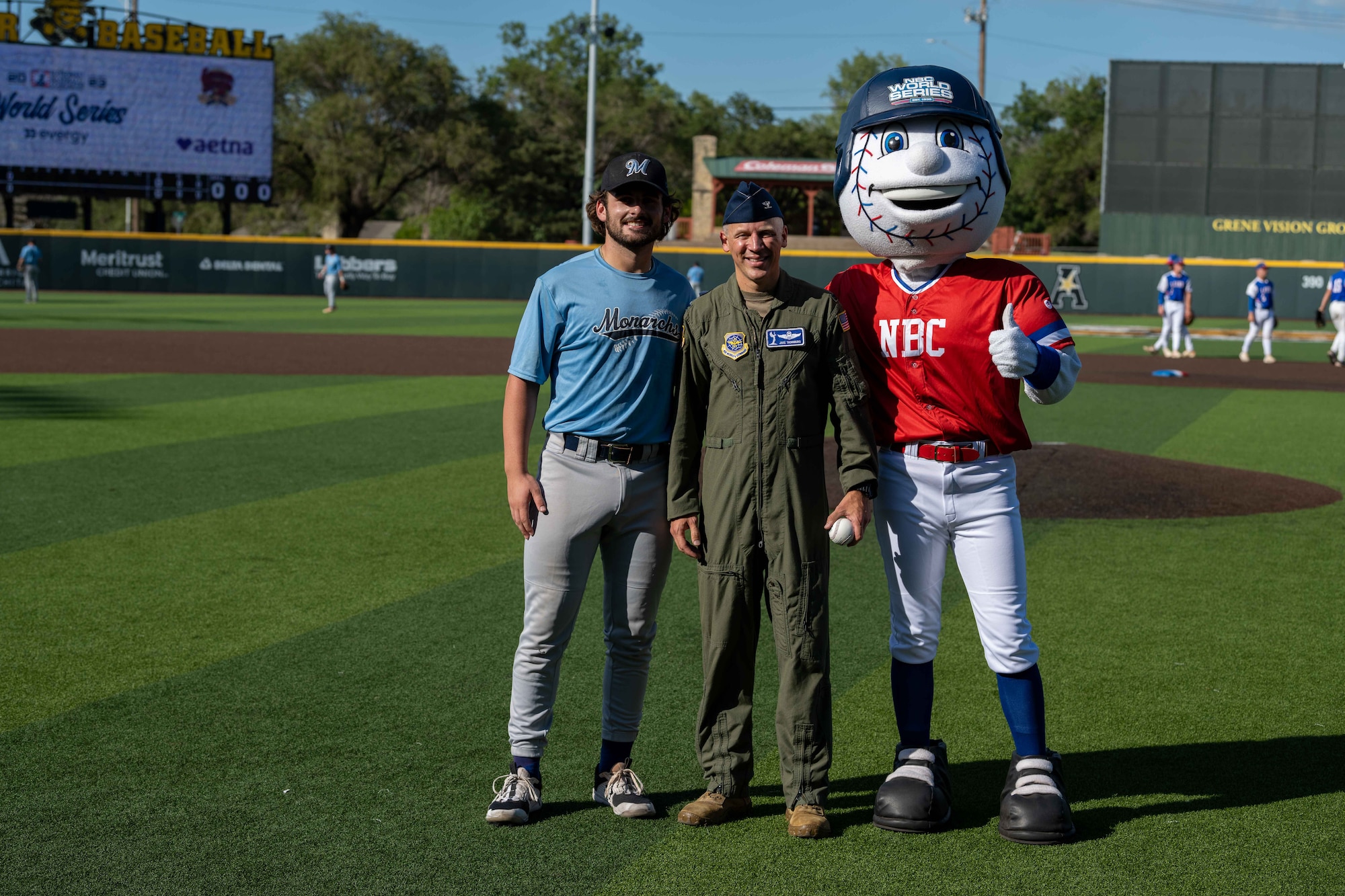 Col. Jacob Thornburg, 22nd Air Refueling Wing deputy commander, poses for a photo with a player from the Hutchison Monarchs at the NBC World Series baseball game at Eck Stadium in Wichita, Kansas, August 4, 2023. The Hutchinson Monarchs rallied from a 4-0 deficit and beat the Hays Larks 6-4 in 11 innings in the pool play opener. (U.S. Air Force photo by Airman 1st Class William Lunn)