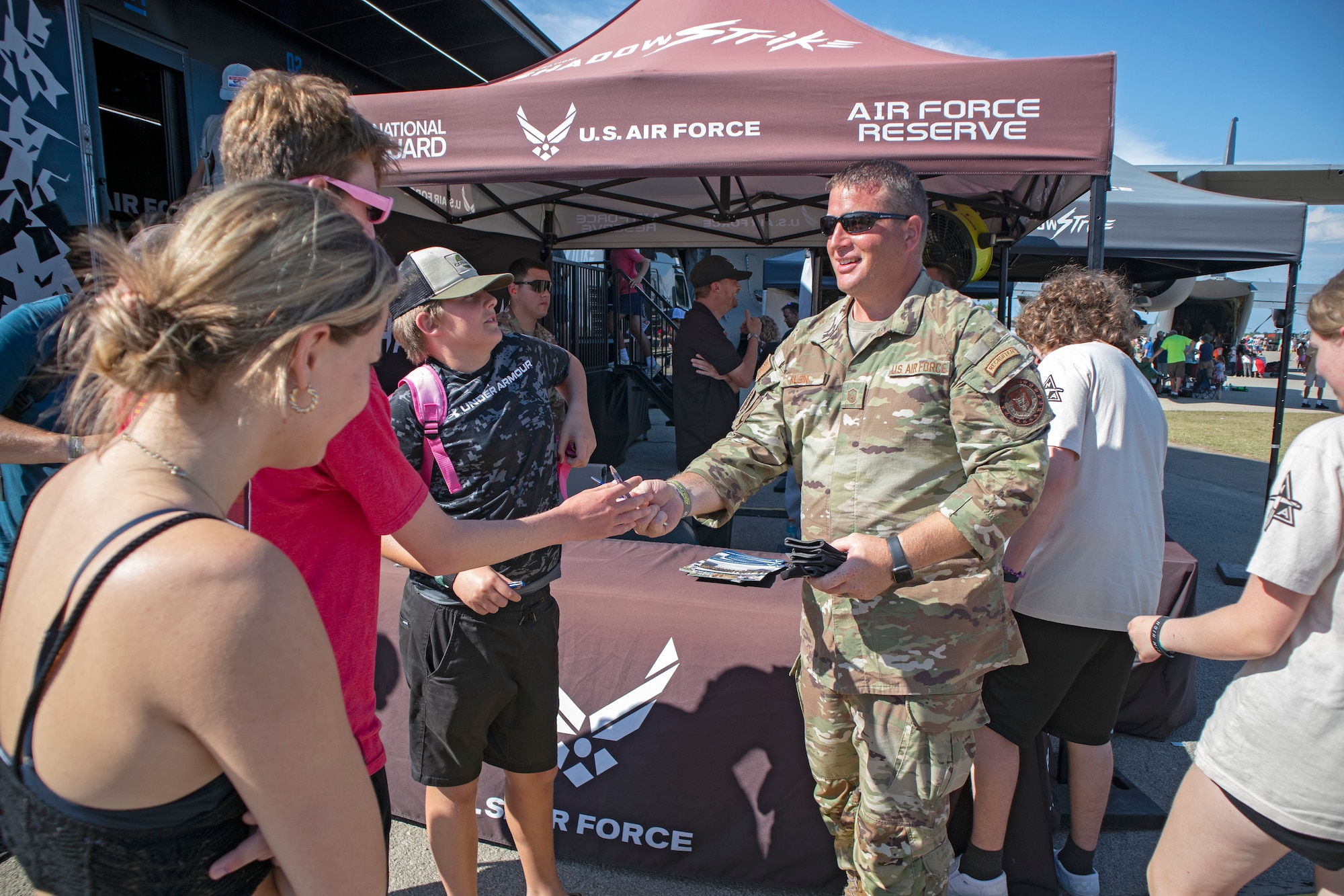 Master Sgt. Justin Klein, 934th Airlift Wing lead recruiter, speaks with airshow visitors