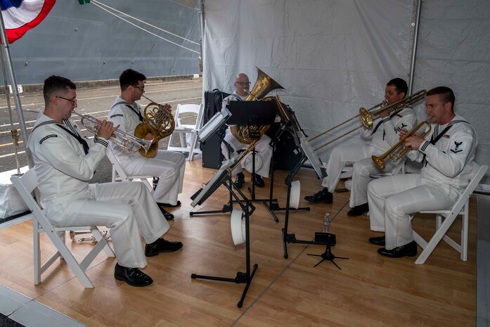 230805-N-YF131-1304 SEATTLE (Aug. 5, 2023) Sailors, assigned to U.S. Navy Band Northwest, perform at the Seattle Fleet Week closing reception hosted by the Arleigh burke-class guided-missile destroyer USS Barry (DDG 52). Seattle Fleet Week is a time-honored celebration of the sea services and provides an opportunity for the citizens of Washington to meet Sailors, Marines and Coast Guardsmen, as well as witness firsthand the latest capabilities of today’s U.S. and Canadian maritime services. (U.S. Navy photo by Mass Communication Specialist 2nd Class Madison Cassidy)