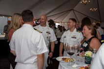 230805-N-YF131-1333 SEATTLE (Aug. 5, 2023) Sailors speak with guests at the Seattle Fleet Week closing reception hosted by the Arleigh burke-class guided-missile destroyer USS Barry (DDG 52). Seattle Fleet Week is a time-honored celebration of the sea services and provides an opportunity for the citizens of Washington to meet Sailors, Marines and Coast Guardsmen, as well as witness firsthand the latest capabilities of today’s U.S. and Canadian maritime services. (U.S. Navy photo by Mass Communication Specialist 2nd Class Madison Cassidy)