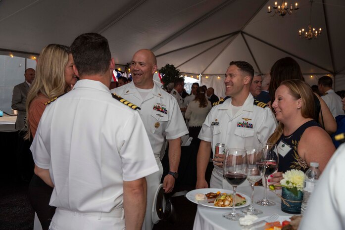 230805-N-YF131-1333 SEATTLE (Aug. 5, 2023) Sailors speak with guests at the Seattle Fleet Week closing reception hosted by the Arleigh burke-class guided-missile destroyer USS Barry (DDG 52). Seattle Fleet Week is a time-honored celebration of the sea services and provides an opportunity for the citizens of Washington to meet Sailors, Marines and Coast Guardsmen, as well as witness firsthand the latest capabilities of today’s U.S. and Canadian maritime services. (U.S. Navy photo by Mass Communication Specialist 2nd Class Madison Cassidy)
