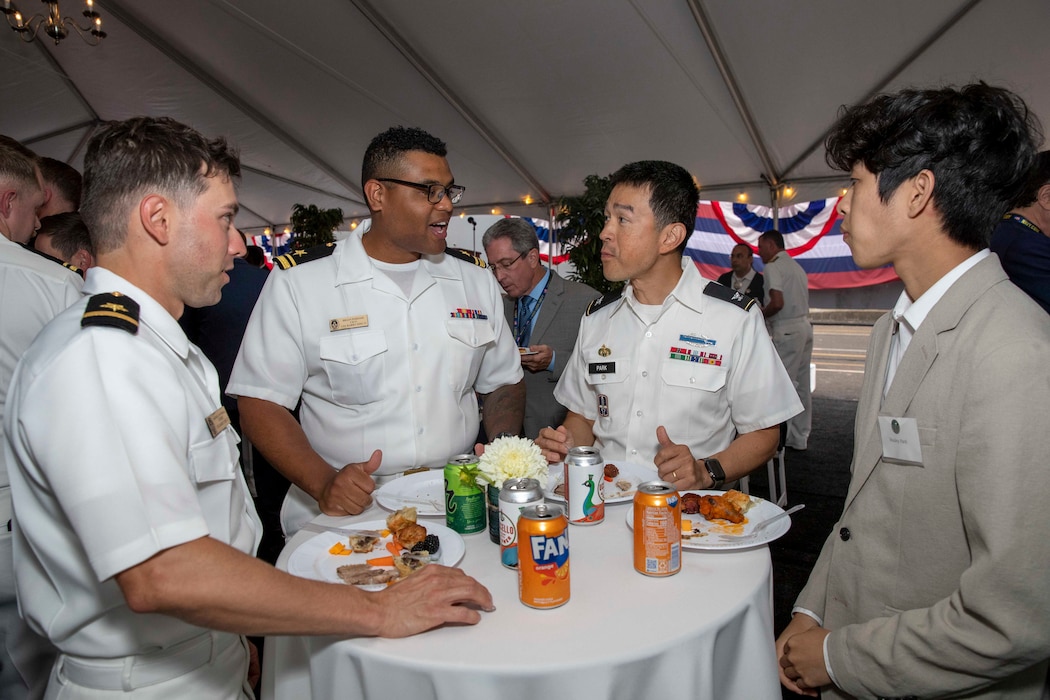 230805-N-YF131-1339 SEATTLE (Aug. 5, 2023) SEATTLE (Aug. 5, 2023) Sailors speak with guests at the Seattle Fleet Week closing reception hosted by the Arleigh burke-class guided-missile destroyer USS Barry (DDG 52). Seattle Fleet Week is a time-honored celebration of the sea services and provides an opportunity for the citizens of Washington to meet Sailors, Marines and Coast Guardsmen, as well as witness firsthand the latest capabilities of today’s U.S. and Canadian maritime services. (U.S. Navy photo by Mass Communication Specialist 2nd Class Madison Cassidy)