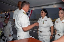 230805-N-YF131-1366 SEATTLE (Aug. 5, 2023) Vice Adm. Michael Boyle, commander, U.S. 3rd Fleet, awards the Navy Achievement Medal to Sailors at the Seattle Fleet Week closing reception hosted by the Arleigh burke-class guided-missile destroyer USS Barry (DDG 52). Seattle Fleet Week is a time-honored celebration of the sea services and provides an opportunity for the citizens of Washington to meet Sailors, Marines and Coast Guardsmen, as well as witness firsthand the latest capabilities of today’s U.S. and Canadian maritime services. (U.S. Navy photo by Mass Communication Specialist 2nd Class Madison Cassidy)