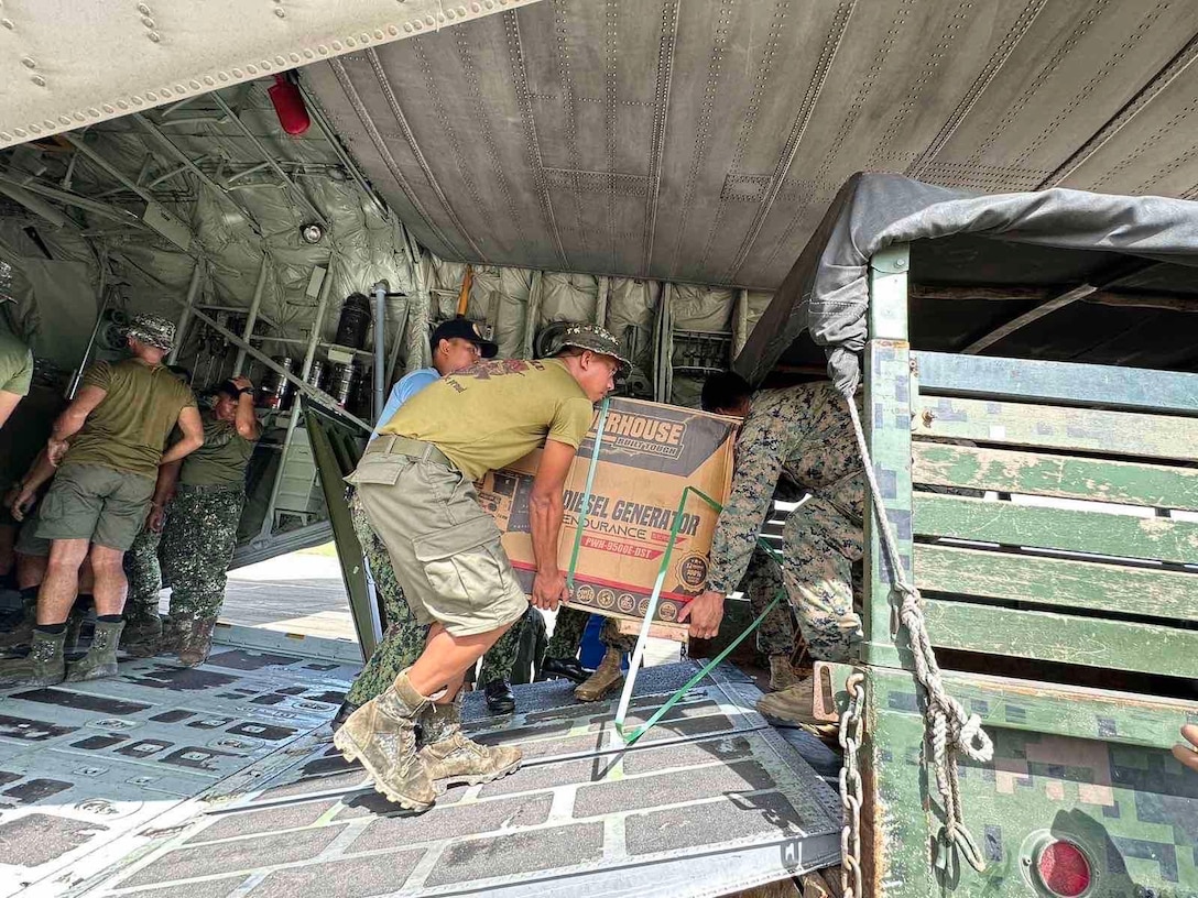 U.S. Marines with 3d Marine Littoral Regiment, 3d Marine Division, assist with offloading equipment provided by the Government of the Philippines, while conducting relief efforts in the wake of Typhoon Egay, international name Typhoon Doksuri at Laoag International Airport, July 29, 2023. At the request of the Armed Forces of the Philippines, U.S. Marines are providing relief and lifesaving capabilities to remote regions of the Philippines. (U.S. Marine Corps Photo: Courtesy Asset)