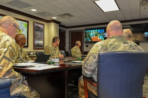 Gen. Thomas Bussiere, commander of Air Force Global Strike Command, briefs Airmen from across the intercontinental ballistic missile community about the initial results from the Missile Community Cancer Study, Barksdale Air Force Base, La., Aug. 7, 2023. (U.S. Air Force Photo by Capt. Joshua Thompson) (This photo has been altered for security purposes by covering the computer screen.)