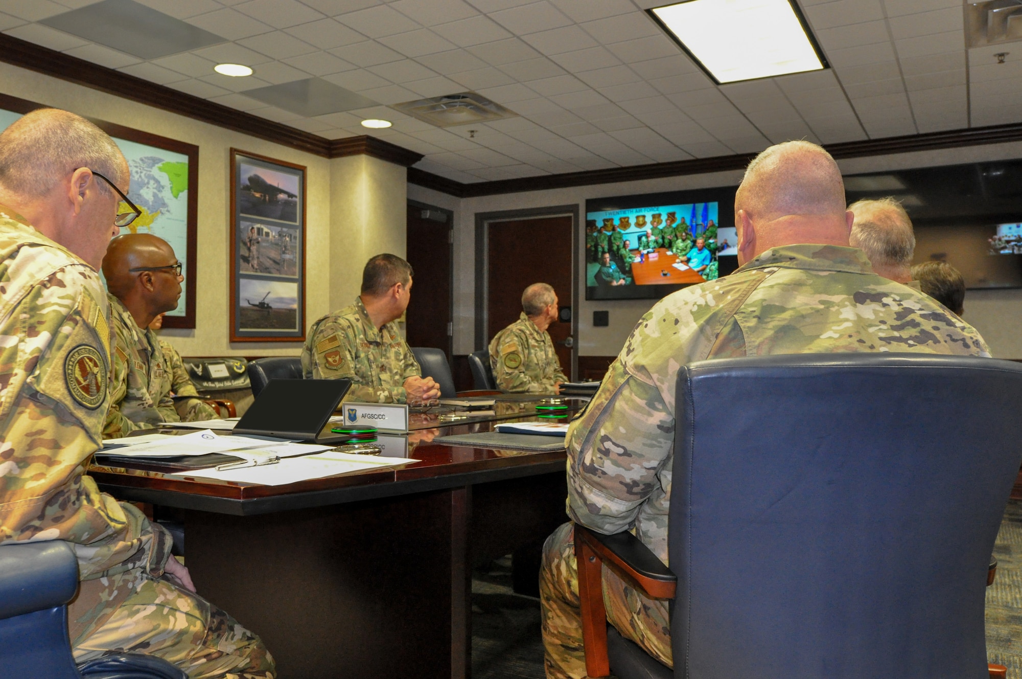 Gen. Thomas Bussiere, commander of Air Force Global Strike Command, briefs Airmen from across the intercontinental ballistic missile community about the initial results from the Missile Community Cancer Study, Barksdale Air Force Base, La., Aug. 7, 2023. (U.S. Air Force Photo by Capt. Joshua Thompson) (This photo has been altered for security purposes by covering the computer screen.)