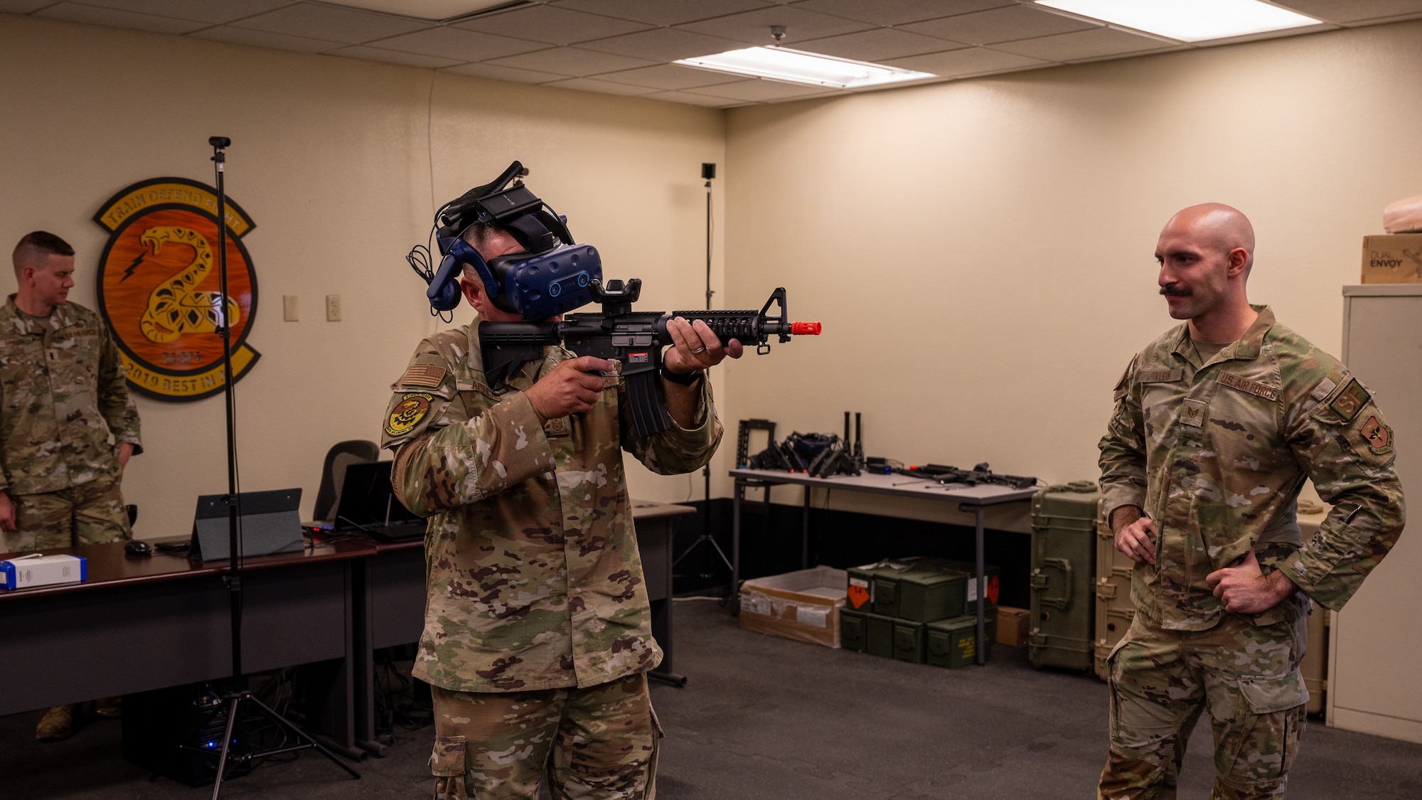 U.S. Air Force Chief Master Sgt. Justin Apticar, Nineteenth Air Force command chief, participates in a security forces simulation training conducted by U.S. Air Force Staff Sgt. Alexander Klein, 56th Security Forces Squadron unit trainer, Aug. 1, 2023, at Luke Air Force Base, Arizona.