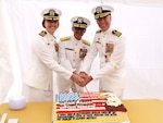 Navy Capt. Jenny S. Burkett, commander, Navy Medicine Readiness and Training Command Camp Pendleton, Rear Adm. lower half Guido F. Valdes, commander, Naval Medical Forces Pacific, and Navy Capt. Peter F. Roberts, former commander, NMRTC CP, cut a cake immediately following the change of command ceremony, Aug. 4, 2023.