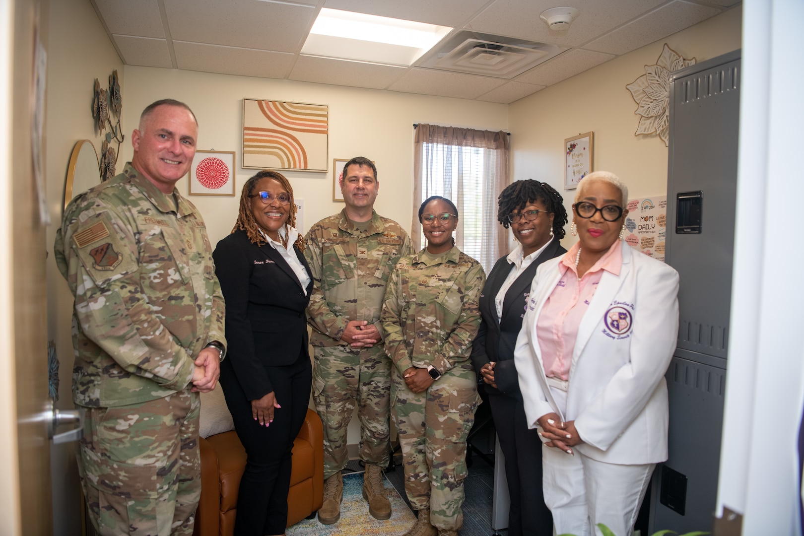 Group of 192nd Wing and Kappa Epsilon Psi Military Sorority, Inc. posing for photo.