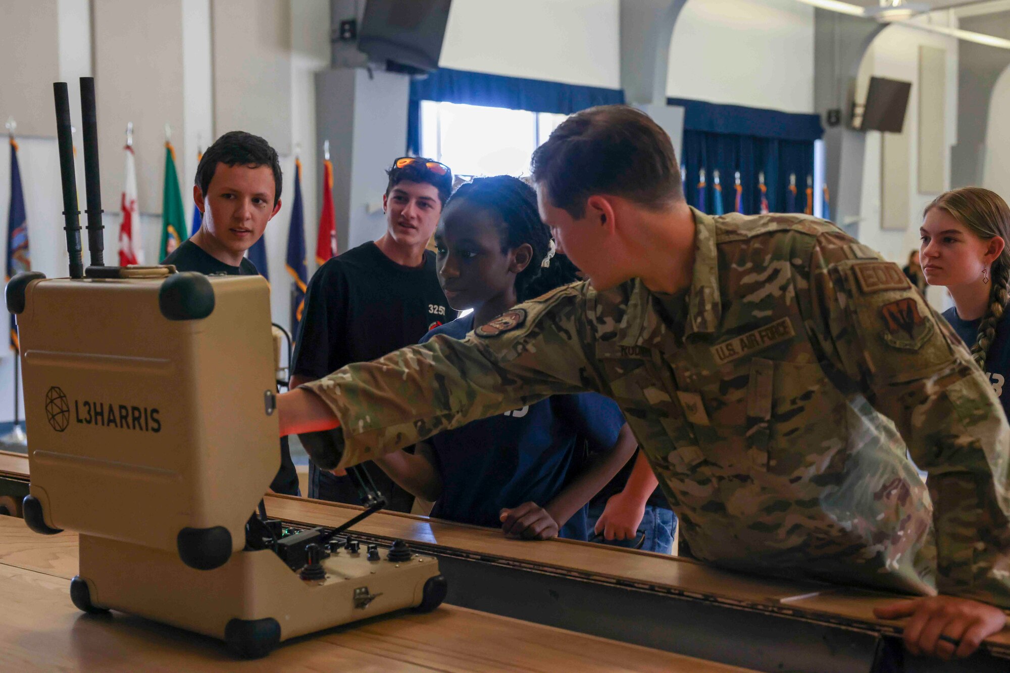 U.S. Air Force Staff Sgt. Hunter Rudnik, 9th Civil Engineer Squadron explosive ordnance technician, demonstrates the T-7 Explosive Ordnance Disposal robot to students with For Inspiration and Recognition of Science and Technology (FIRST), during a base tour Aug. 3, 2023, at Beale Air Force Base, California.