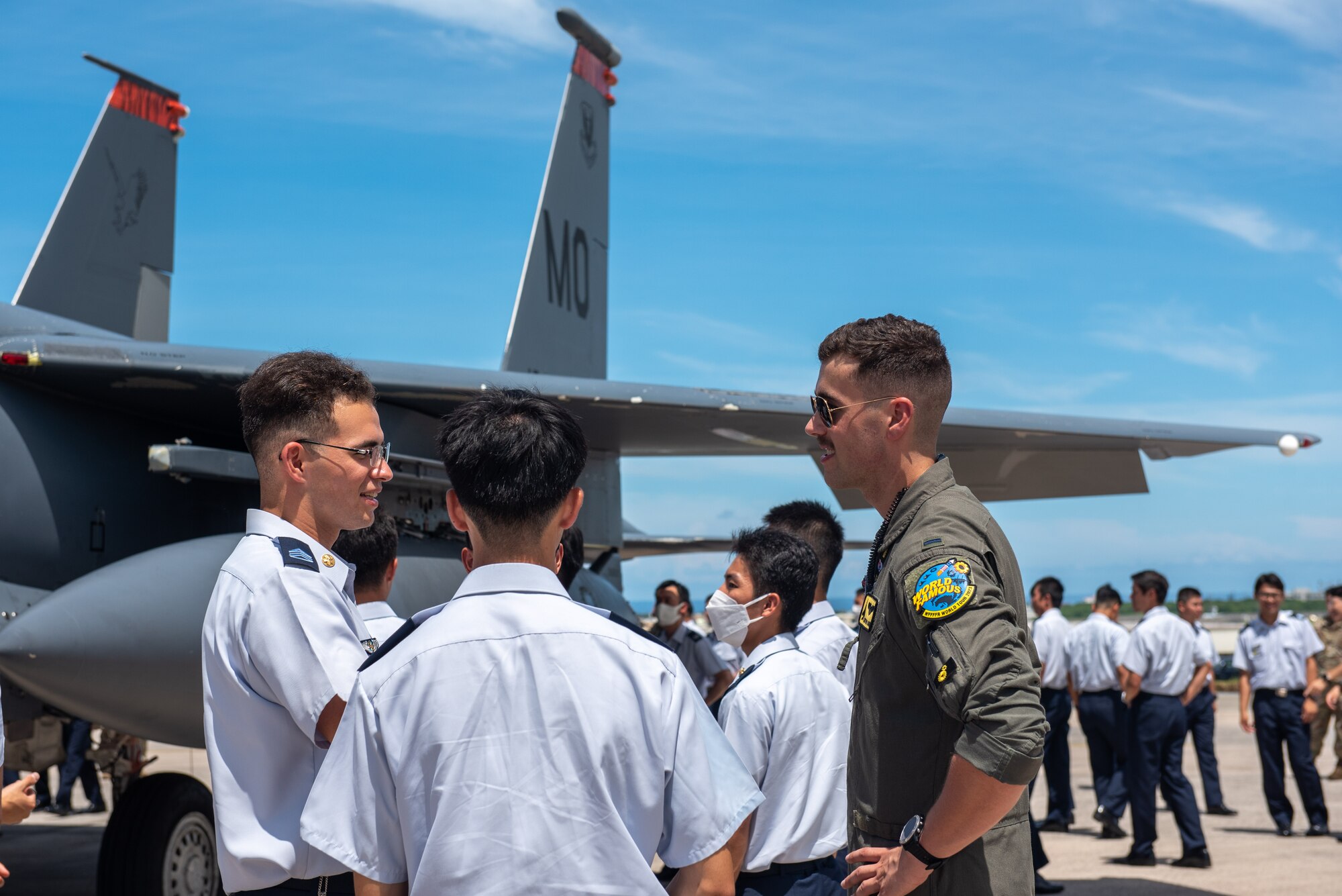 Japan Air Self-Defense Force cadets speak to a U.S. Air Force pilot