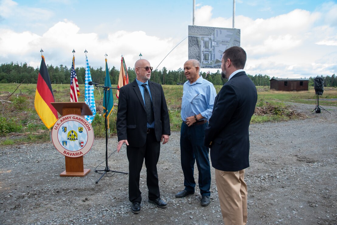 U.S. Army Corps of Engineers, Europe District Regional Program Manager for U.S. Army Garrison Bavaria Peter Barth, Europe District Chief of Program Management Branch Lalit Wadhwa and Europe District Chief of Programs and Project Management Justin Wetherwax discuss the significance of the Operational Readiness Training Complex project the morning of the ORTC groundbreaking ceremony at the Grafenwoehr Training Area in Germany August 4, 2023. The groundbreaking celebrated the first major steps in construction for the ORTC project which will be built over several years and include all the facilities needed for an entire brigade set of troops and equipment to train and operate on a rotational basis. (U.S. Army photo by Alfredo Barraza)