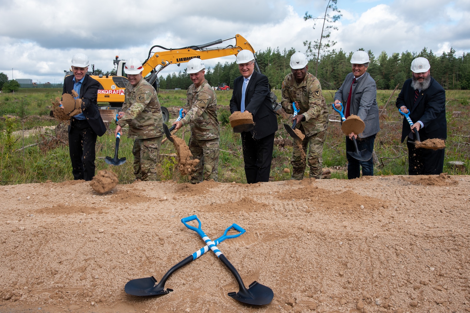 Bavarian State Construction Department Chief Daniel Oden; U.S. Army Corps of Engineers, Europe District Commander Col. Dan Kent; 7th Army Training Command Commanding General Brig. Gen. Steven Carpenter; Bavarian State Minister of the Interior Joachim Herrmann; U.S. Army Garrison Bavaria Garrison Commander Kevin Poole, Grafenwoehr Mayor Edgar Knobloch and U.S. Army Garrison Bavaria Director of Public Works John Sturtz ceremonially break ground  for the Operational Readiness Training Complex at Grafenwoehr Training Area in Germany August 4, 2023. The groundbreaking celebrated the first major steps in construction for the ORTC project which will be built over several years and include all the facilities needed for an entire brigade set of troops and equipment to train and operate on a rotational basis. (U.S. Army photo by Alfredo Barraza)