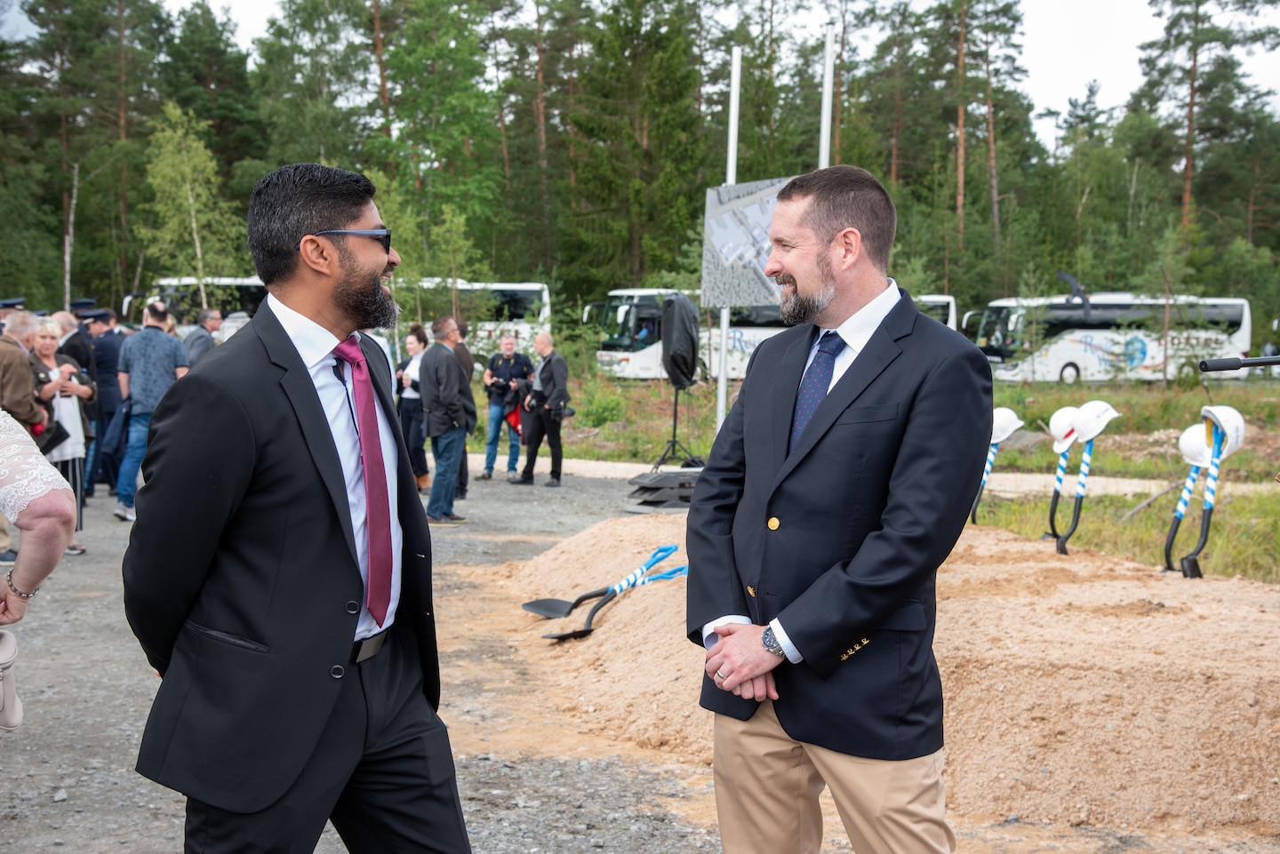 U.S. Army Corps of Engineers, Europe District Operational Readiness Training Complex Project Manager Erasmo Rivera and Europe District Chief of Programs and Project Management Justin Wetherwax discuss the significance of the ORTC project the morning of the ORTC groundbreaking ceremony at the Grafenwoehr Training Area in Germany August 4, 2023. The groundbreaking celebrated the first major steps in construction for the ORTC project which will be built over several years and include all the facilities needed for an entire brigade set of troops and equipment to train and operate on a rotational basis. (U.S. Army photo by Alfredo Barraza)