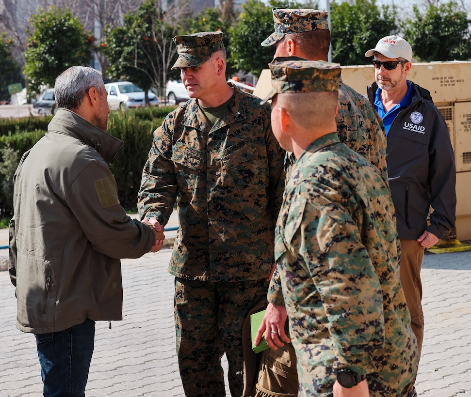 Brigadier Gen. Andrew T. Priddy, commanding general, Task Force 61/2, and a member of U.S. Agency for International Development (USAID) greet a member of the Turkish Ministry of Health, at Antakya, Türkiye, March 2, 2023. At the request of the Turkish government, U.S. military personnel assigned to Task Force 61/2 and 39th Air Base Wing were tasked with building a field hospital for the citizens who were affected by the Feb. 6 earthquakes. Upon completion of their efforts on March 2, 2023, leaders from Task Force 61/2 (TF 61/2), and 39th Air Base Wing conducted a final walk-through before the Turkish Ministry of Health began operations at the field hospital.  (U.S. Marine Corps photo by Sgt. James Bourgeois/Released)