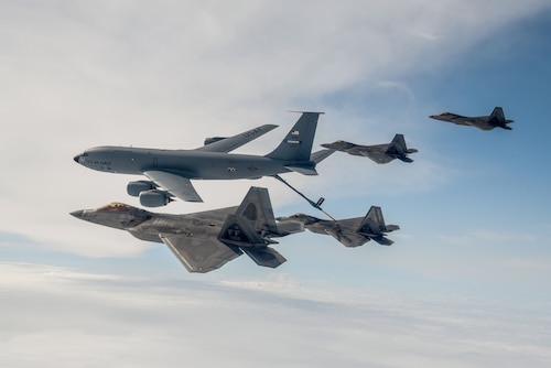 Four U.S. Air Force F-22 Raptors and a KC-135 Stratotanker, assigned to the 434th Air Refueling Wing, Grissom Air Reserve Base, Ind., conduct aerial refueling over the continental United States, Aug. 21, 2018, during the Northern Lightning 18-2 exercise. Northern Lightning is one of seven Air National Guard joint accredited exercises held at a Combat Readiness Training Center and provides tailored, cost-effective and realistic combat training for participating units in a joint and multinational environment. (U.S. Air National Guard photo by Tech. Sgt. Mary E. Greenwood)