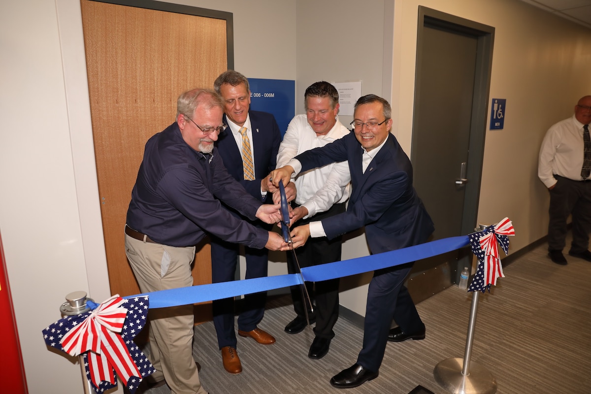 Director of Aerospace Systems Dr. Mike Gregg, AFRL Executive Director Timothy Sakulich, Integrated Capabilities Director Chris Ristich and Materials and Manufacturing Director Darrell Phillipson cut a ceremonial ribbon at the grand opening of AFRL’s new joint-use Secure Corporate Facility at Wright-Patterson Air Force Base, July 28, 2023. The new secure facility, a one-stop shop for communication and collaboration, is the first of its kind for AFRL, owing to its expansive accommodations and premier network security. The location offers ample workspace and a highly protected environment in which individuals or teams representing a variety of AFRL directorates can collaborate alongside research and industry partners to accomplish highly classified cross-organizational tasks. (U.S. Air Force photo)