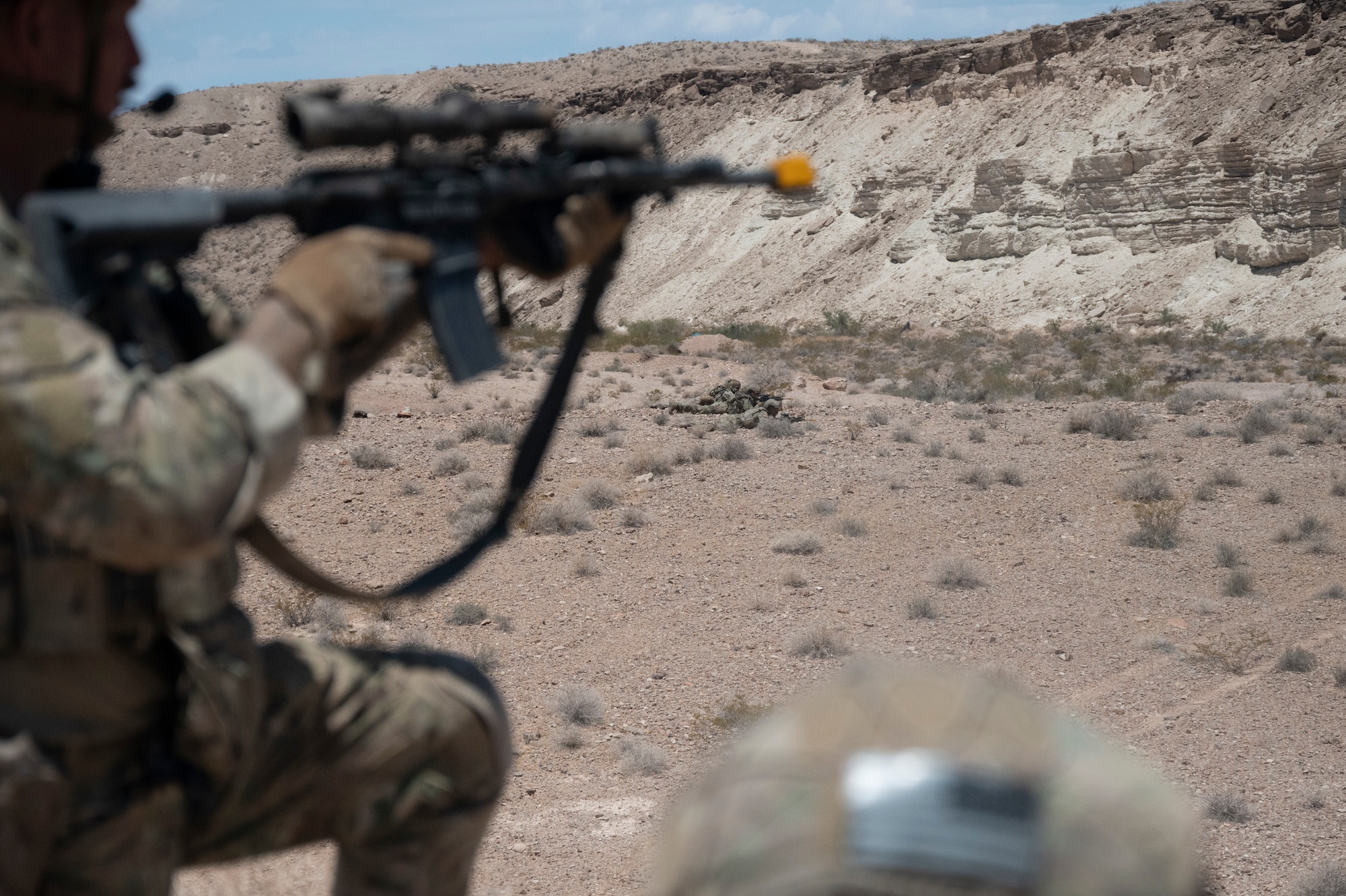 U.S. Airmen stand guard during an air base defense rehearsal during exercise Red Flag 23-3 at Nellis AFB, Nevada, July 25, 2023. These defenders were establishing security for the forward operating site and contingency locations necessary to perform Agile Combat Employment. (U.S. Air Force photo by Master Sgt. Niles Bartram)