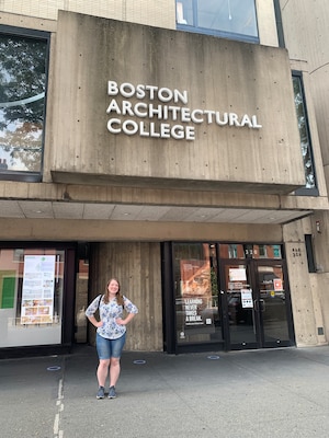 Woman in front of building