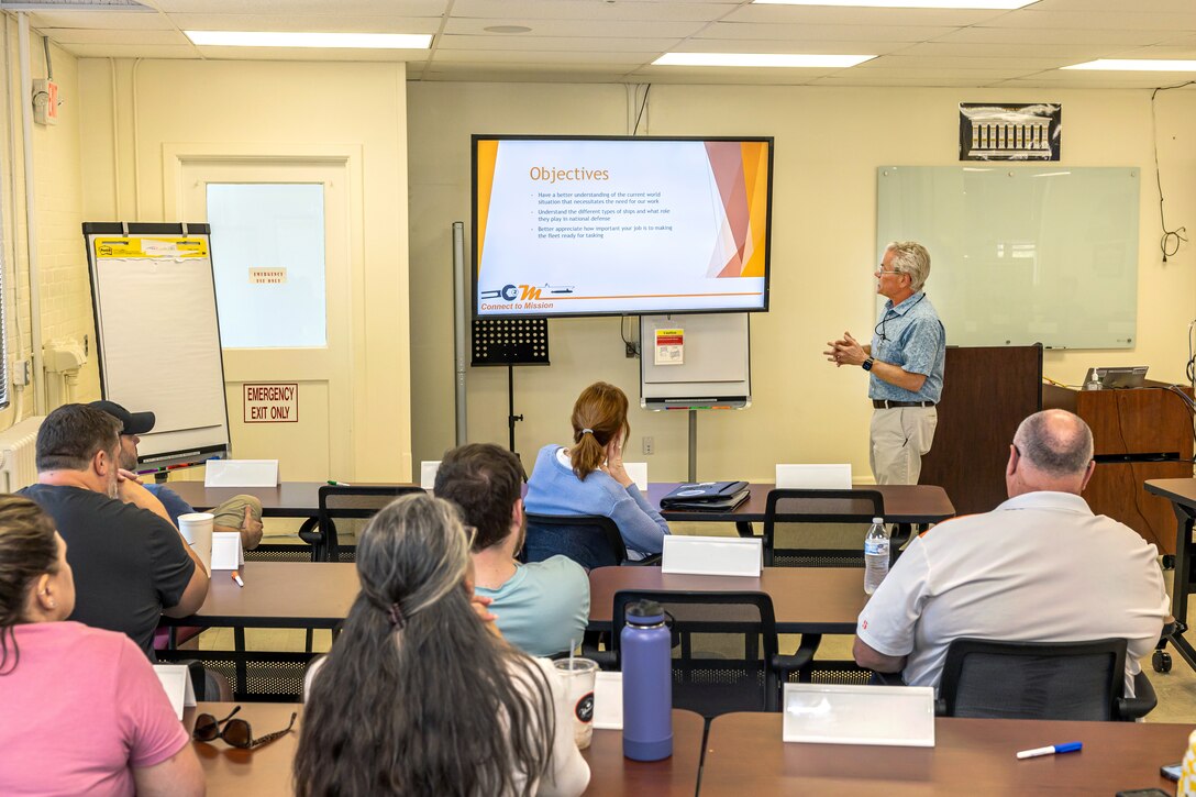 Kevin Wilke, division head, Code 105.7, Radiological Controls Special Projects, leads a recent Navy 101 Connect to Mission (C2M) presentation for Code 1180, Command University, employees, designed to help them better understand the mission of the U.S. Navy, at Puget Sound Naval Shipyard & Intermediate Maintenance Facility, in Bremerton, Washington. (U.S. Navy photo by Jeb Fach)