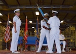 Photos of two Navy Commanders - the outgoing commander on the left and the incoming commander on the right.