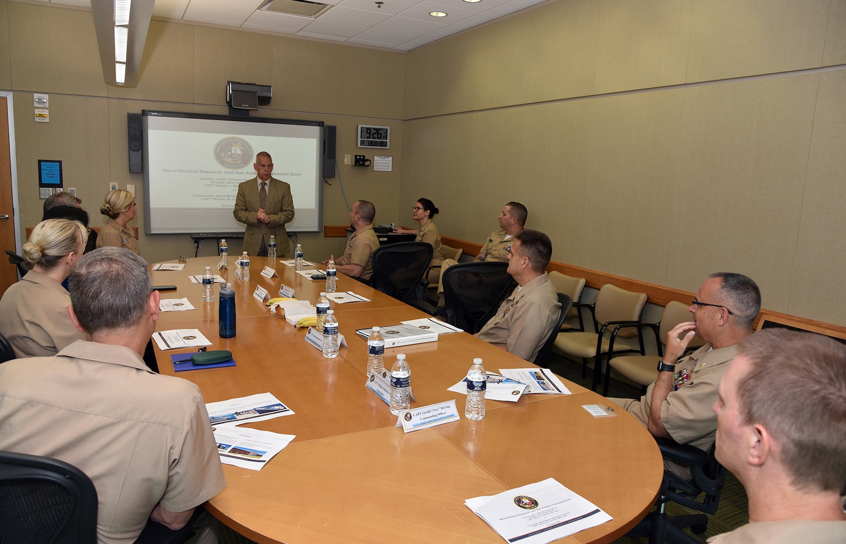 JOINT BASE SAN ANTONIO-FORT SAM HOUSTON – (Aug. 3, 2023) – Dr. Sylvain Cardin, chief science director, Naval Medical Research Unit (NAMRU) San Antonio, briefs Capt. Robert Hawkins, director, J3/5/7, Defense Health Agency (DHA) and director, U.S. Navy Nurse Corps, along with Capt. William Deniston, commander, Naval Medical Research Command (NMRC), during a visit and tour of NAMRU San Antonio facilities at the Battlefield Health and Trauma Research Institute. NAMRU San Antonio’s mission is to conduct gap driven combat casualty care, craniofacial, and directed energy research to improve survival, operational readiness, and safety of Department of Defense (DoD) personnel engaged in routine and expeditionary operations. It is one of the leading research and development laboratories for the U.S. Navy under the DoD and is one of eight subordinate research commands in the global network of laboratories operating under NMRC in Silver Spring, Md. (U.S. Navy photo by Burrell Parmer, NAMRU San Antonio Public Affairs/Released)