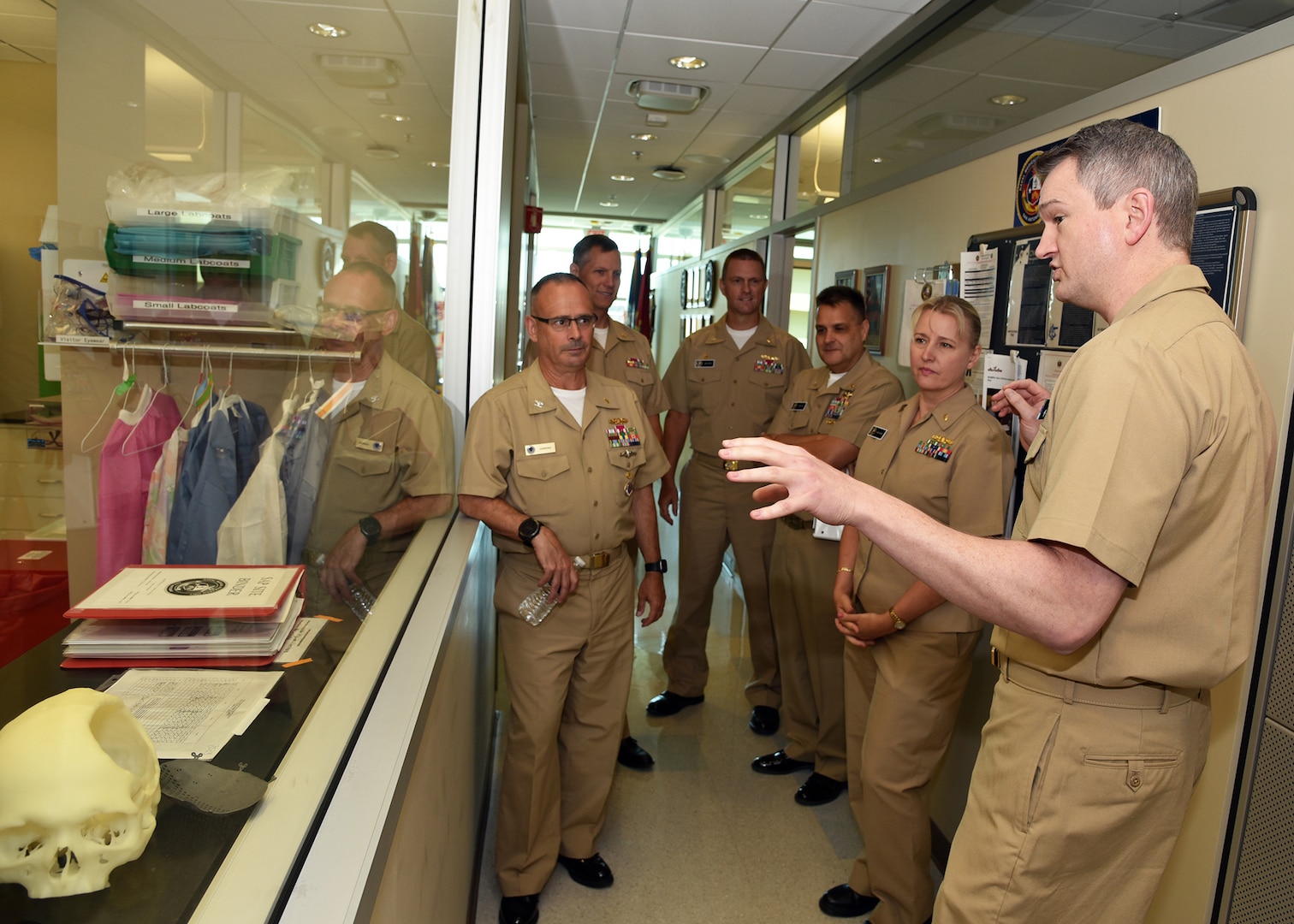 JOINT BASE SAN ANTONIO-FORT SAM HOUSTON – (Aug. 3, 2023) – Cmdr. Drew Havard, deputy director, Craniofacial Health and Restorative Medicine (CHRM), Naval Medical Research Unit (NAMRU) San Antonio, gives a tour of NAMRU San Antonio facilities at the Battlefield Health and Trauma Research Institute to Capt. Robert Hawkins (left), director, J3/5/7, Defense Health Agency (DHA) and director, U.S. Navy Nurse Corps. NAMRU San Antonio’s mission is to conduct gap driven combat casualty care, craniofacial, and directed energy research to improve survival, operational readiness, and safety of Department of Defense (DoD) personnel engaged in routine and expeditionary operations. It is one of the leading research and development laboratories for the U.S. Navy under the DoD and is one of eight subordinate research commands in the global network of laboratories operating under Naval Medical Research Command in Silver Spring, Md. (U.S. Navy photo by Burrell Parmer, NAMRU San Antonio Public Affairs/Released)