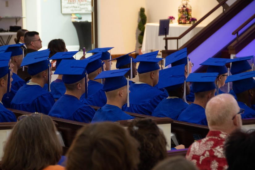 Cadets of the 48th graduating class of the Bluegrass ChalleNGe Academy look on as guests speak at their graduation ceremony in Radcliff, Ky., June 17, 2023.