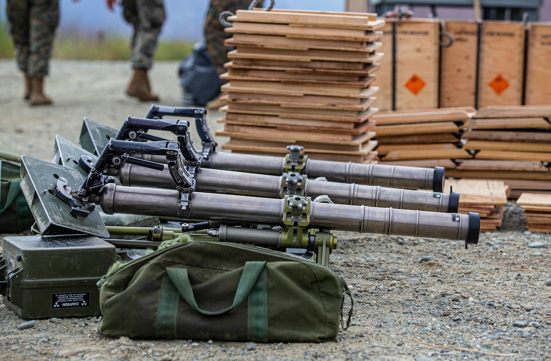 U.S. Marine 60mm M224 mortars wait by ammo crates during a live-fire range on Mortar Point 6 on Marine Corps Base Camp Pendleton, California, June 30, 2020.  Marines with the Infantry Unit Leader Course, Advanced Infantry Training Battalion, School of Infantry - West, utilized this weapon system and other weapon systems to increase proficiency and readiness. The Marines that are participating in the course will leave as 0369 Infantry unit leaders. (U.S. Marine Corps photo by Lance Cpl. Andrew Cortez)