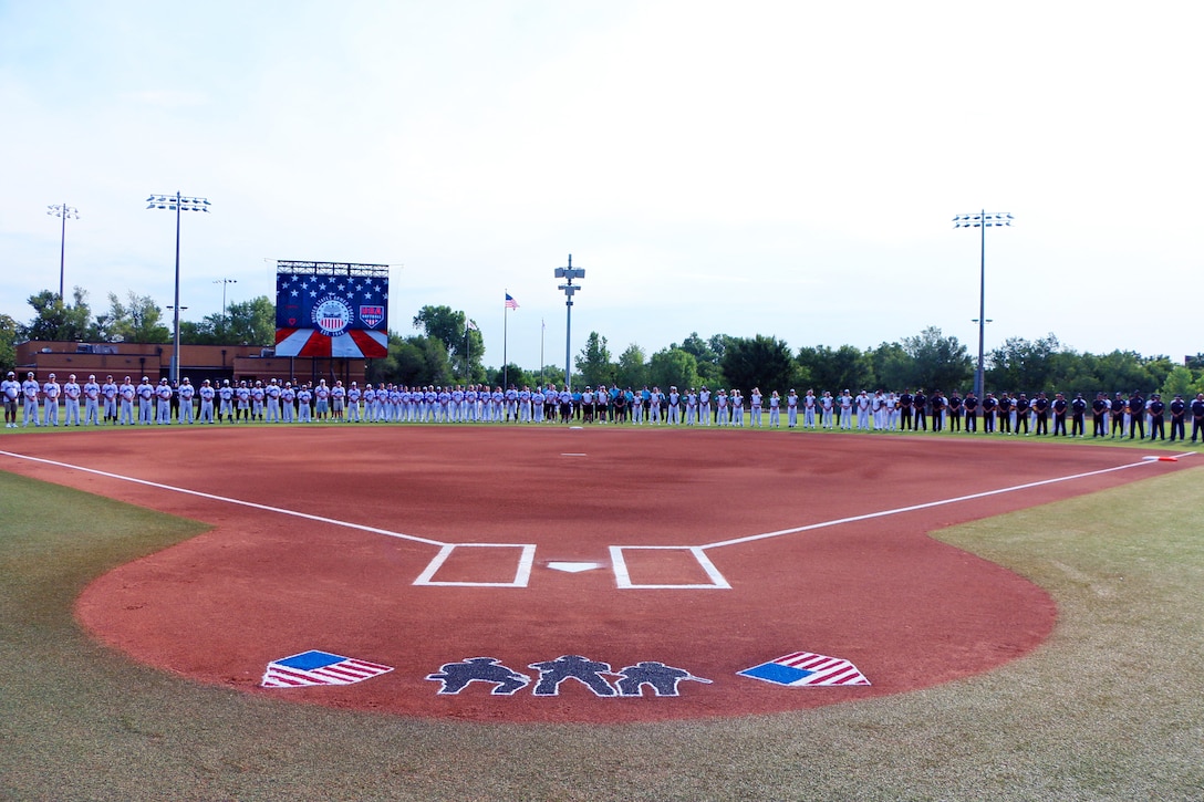 Teams line up during the opening ceremony of the 2023 Armed Forces Sports Softball Championship hosted by USA Softball at the National Hall of Fame Stadium in Oklahoma City, Okla.  Championship features men and women teams from the Army, Marine Corps, Navy (with Coast Guare Personnel), and Air Force. (Dept. of Defense Photo by Mr. Steven Dinote - Released)