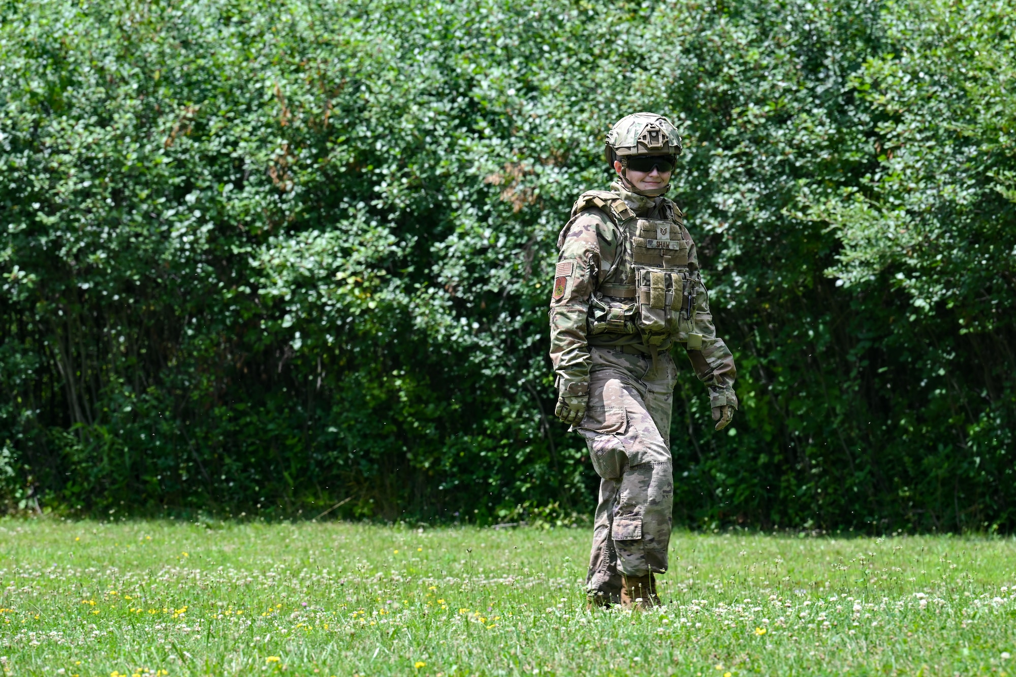 Tech. Sgt. Cara Shaw, an Integrated Defense Leadership Course cadre member assigned to the 307th Security Forces Squadron, Barksdale Air Force Base, Louisiana, looks for the spoon of a detonated grenade on July 21, 2023, at Camp James A. Garfield Joint Military Training Center, Ohio.