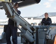 Airman 1st Class Noah China (left) and Senior Airman Ariana Fernandez, 5th Aircraft Maintenance Squadron weapons loaders, position an inert precision guided munition for loading onto a B-52H Stratofortress during the Global Strike Challenge at Minot Air Force Base, North Dakota, Aug. 3, 2023. The Global Strike Challenge fosters esprit de corps through rigorous competition and teamwork amongst the units that participate. (U.S. Air Force photo by Airman 1st Class Kyle Wilson)