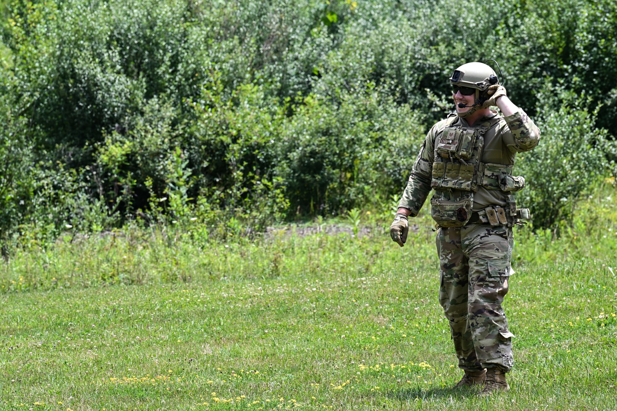 Tech. Sgt. Johnathan Kling, an Integrated Defense Leadership Course cadre member assigned to the 307th Security Forces Squadron, Barksdale Air Force Base, Louisiana, receives radio communication prior to detonating a grenade on July 21, 2023, at Camp James A. Garfield Joint Military Training Center, Ohio.