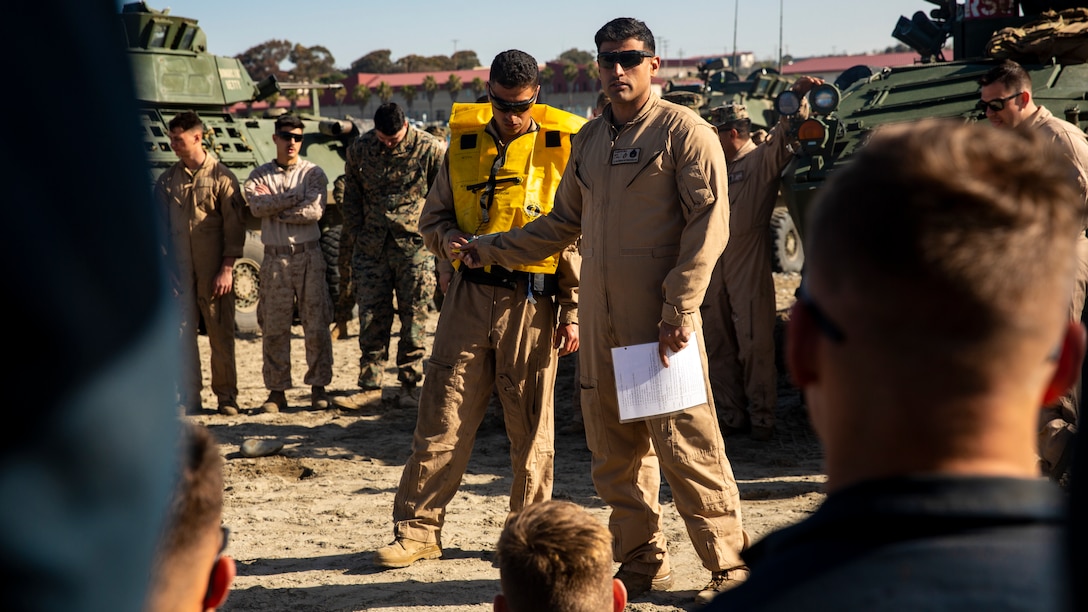 U.S. Marine Staff Sgt. Guillermo Torrescruz, a combat instructor with Light Armored Reconnaissance Training Company, Advanced Infantry Training Battalion, School of Infantry - West, gives his students a safety brief prior to LAR Marine Course 2-20’s LAV swim operations at the Del Mar boat basin on Marine Corps Base Camp Pendleton, California, Feb. 11, 2020. The mission of LARTC is to train entry-level light armored reconnaissance crewmen in the tactical employment of the LAV. (U.S. Marine Corps photo by Lance Cpl. Melissa I. Ugalde)