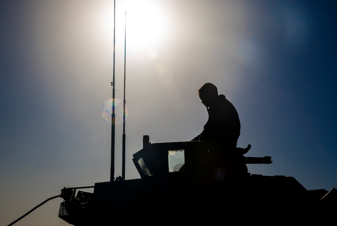A U.S. Marine with Light Armored Reconnaissance Training Company, Advanced Infantry Training Battalion, School of Infantry - West, performs a final systems check in an LAV-25 Light Armored Vehicle prior to LAR Marine Course 2-20’s LAV swim operations at the Del Mar boat basin on Marine Corps Base Camp Pendleton, California, Feb. 11, 2020. The mission of LARTC is to train entry-level light armored reconnaissance crewmen in the tactical employment of the LAV. (U.S. Marine Corps photo by Lance Cpl. Melissa I. Ugalde)
