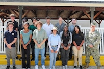 Naval Surface Warfare Center Indian Head Division’s (NSWC IHD) Naval Energetics Technology Apprenticeship Program (NETAP) students and NSWC IHD Commanding Officer Capt. Eric Correll celebrate the end of their three week course at Naval Support Facility Indian Head, July 28. NETAP gives students an opportunity to engage in a hands-on internship allowing them to develop their engineering skills. Over the course of the program, students learned and improved upon their power tool, soldering, and programming skills by building mini unmanned underwater vehicles.