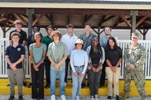 Naval Surface Warfare Center Indian Head Division’s (NSWC IHD) Naval Energetics Technology Apprenticeship Program (NETAP) students and NSWC IHD Commanding Officer Capt. Eric Correll celebrate the end of their three week course at Naval Support Facility Indian Head, July 28. NETAP gives students an opportunity to engage in a hands-on internship allowing them to develop their engineering skills. Over the course of the program, students learned and improved upon their power tool, soldering, and programming skills by building mini unmanned underwater vehicles.
