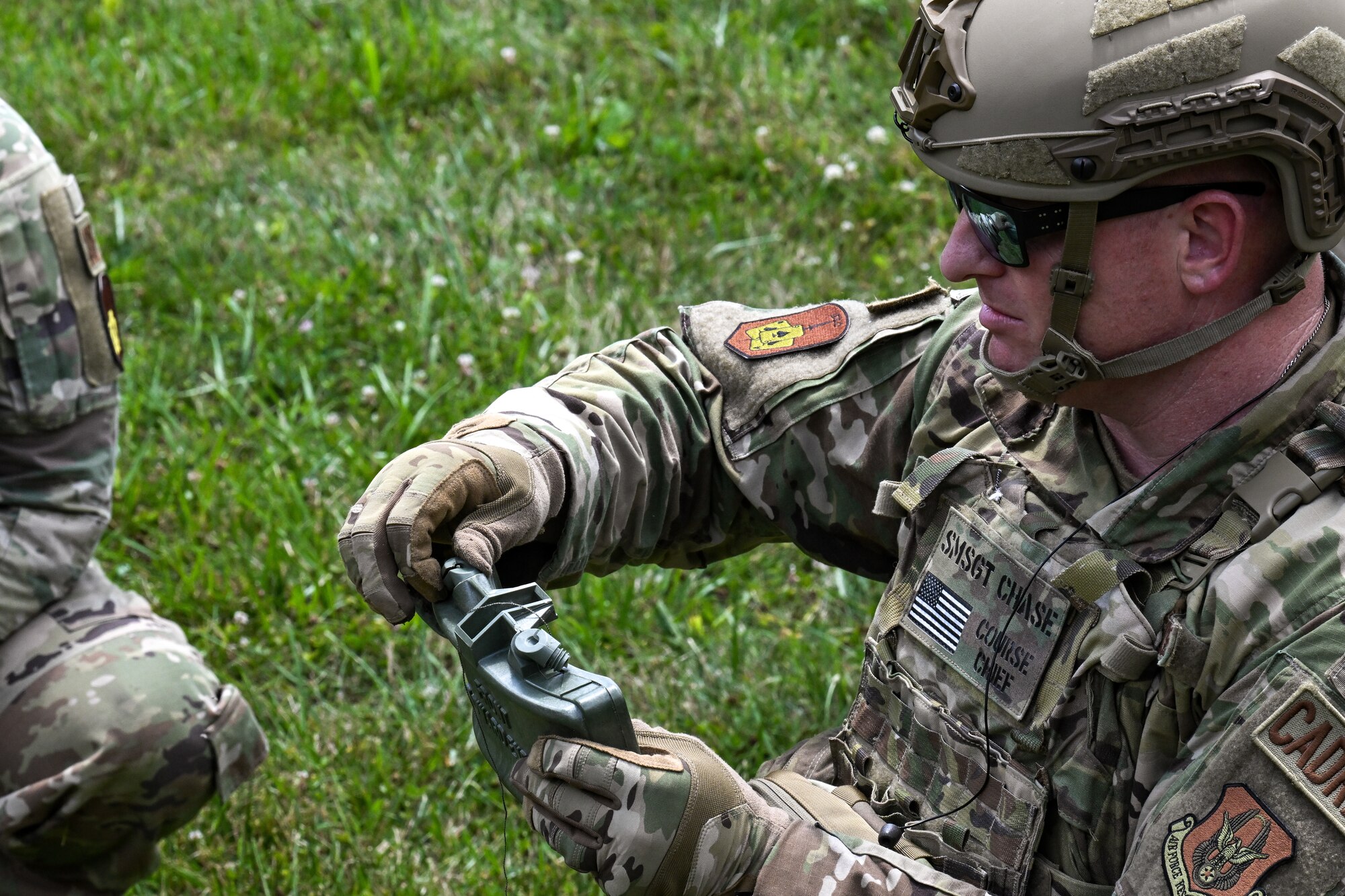 Senior Master Sgt. Daniel Chase, the Integrated Defense Leadership Course chief assigned to the 310th Security Forces Squadron, Schriever Space Force Base, Colorado, prepares a claymore for detonation on July 21, 2023, at Camp James A. Garfield Joint Military Training Center, Ohio.