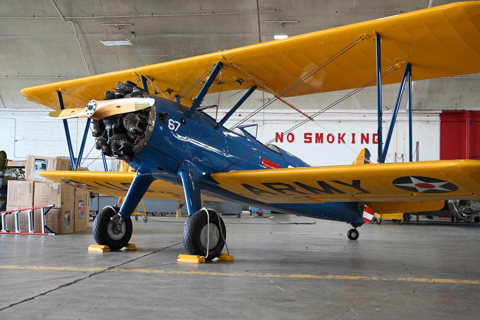 The Tuskegee Airmen PT-17 trainer sits in the restoration hangar at the National Museum of the USAF.
