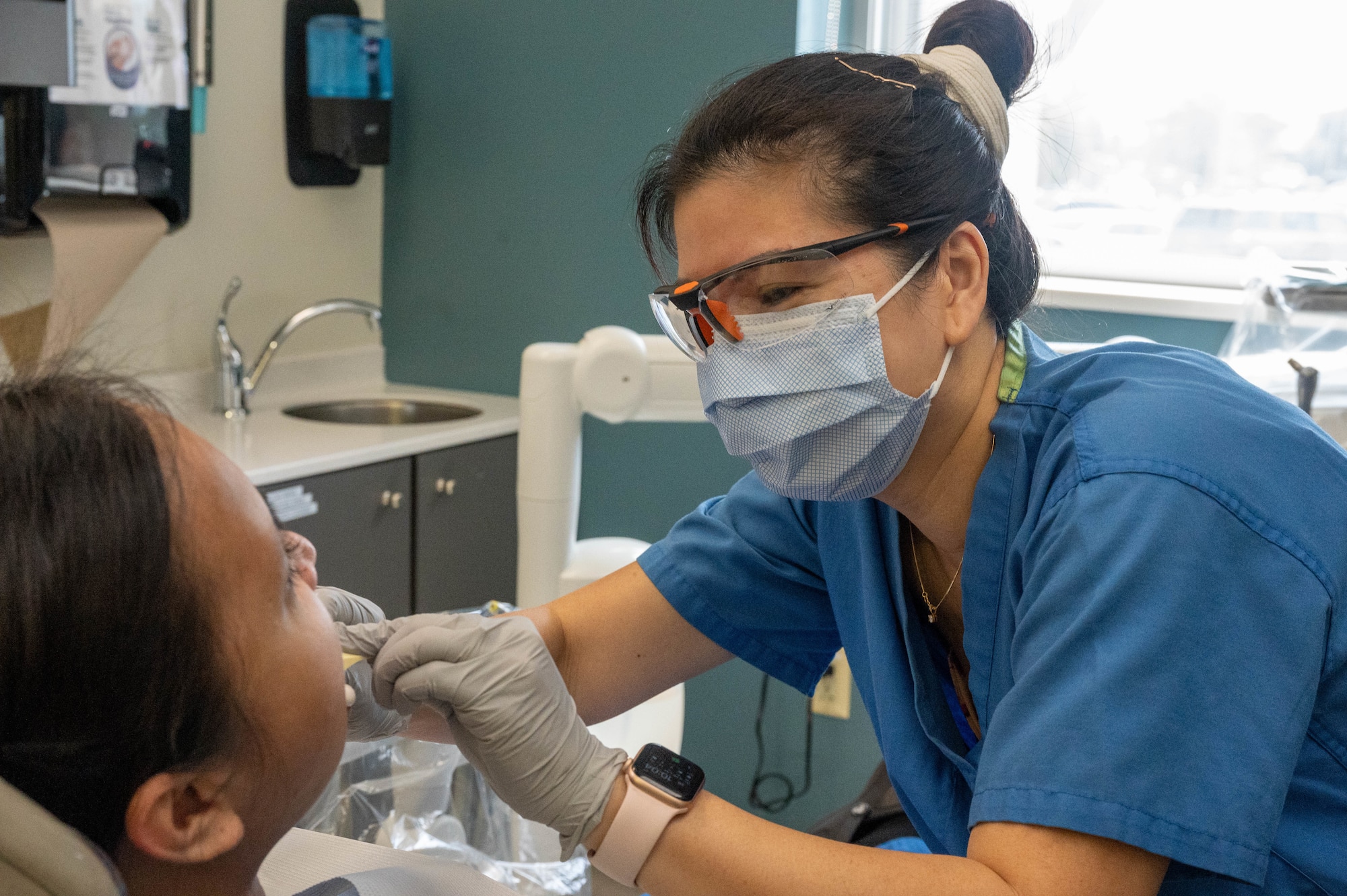 Ly Nguyen, 56th Operational Medical Readiness Squadron dental assistant, demonstrates how an impression of a patient’s mouth is done, July 26, 2023, at Luke Air Force Base, Arizona.