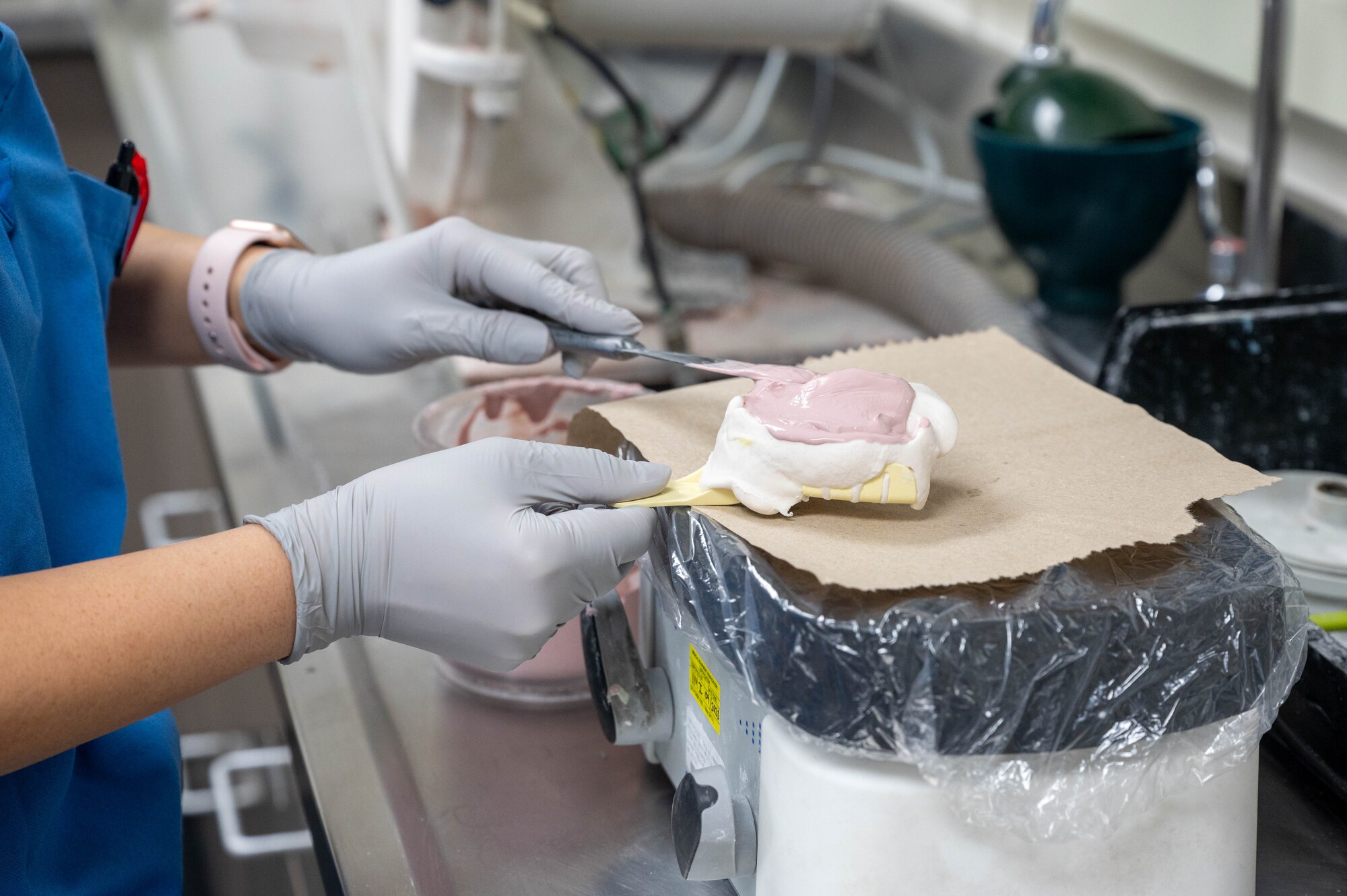Ly Nguyen, 56th Operational Medical Readiness Squadron dental assistant, fills an impression mold taken from a patient’s mouth, July 26, 2023, at Luke Air Force Base, Arizona.