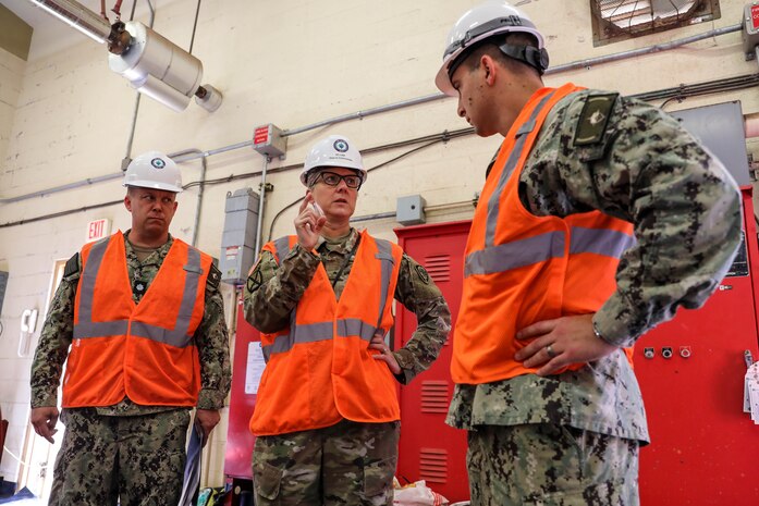 Joint Task Force-Red Hill (JTF-RH) Deputy Commander, U.S. Army Brig. Gen. Michelle Link (center), discusses preparations for water-based fire suppressant system testing at the Red Hill Bulk Fuel Storage Facility (RHBFSF) on Joint Base Pearl Harbor-Hickam, Hawaii, Aug. 2, 2023. JTF-RH is in phase three of its five-phase defueling plan. Personnel are focused on completing quality control tasks, training, response preparation, the National Environmental Policy Act Environmental Assessment, regulatory approvals and operational planning for all future major milestones. This extensive preparatory work will help ensure the safe and expeditious defueling of the RHBFSF. (DoD photo by U.S. Army Sgt. Kyler Chatman)