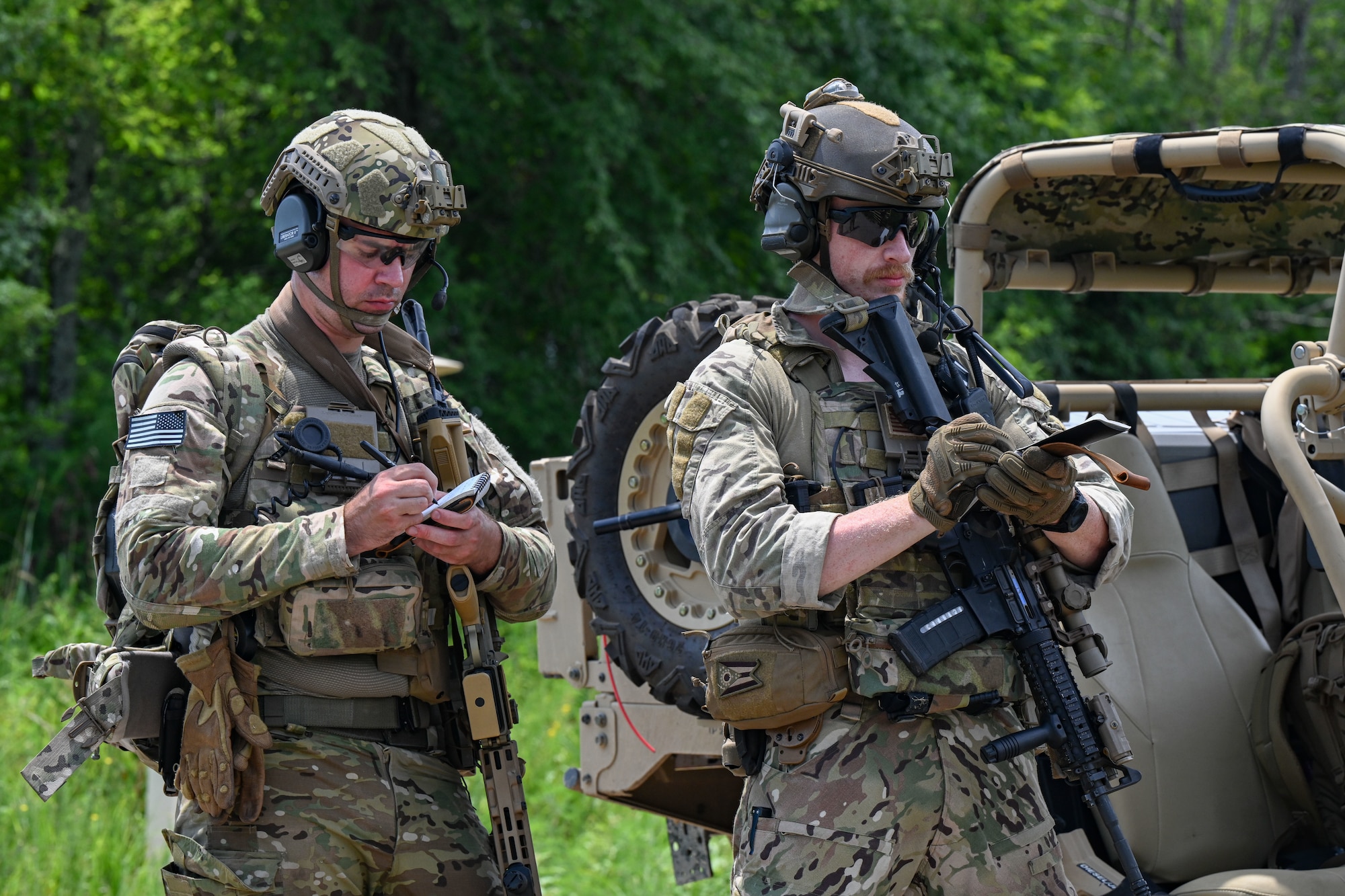 EOD Airmen take notes.