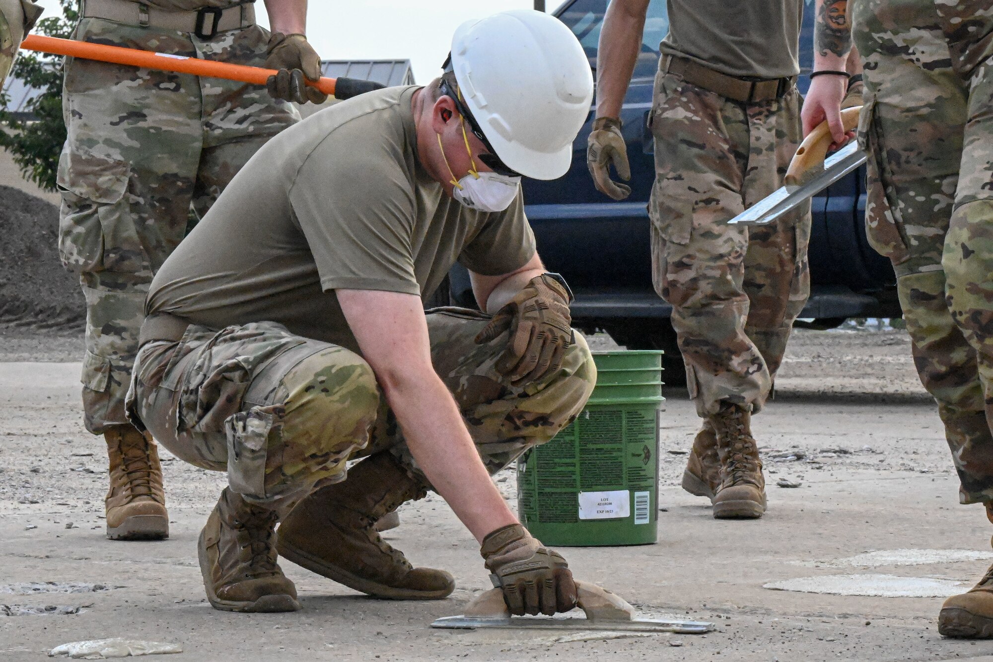 Airman paves concrete.