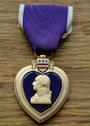 Photo of The Purple Heart medal bears the likeness of President George Washington