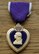 Photo of The Purple Heart medal bears the likeness of President George Washington